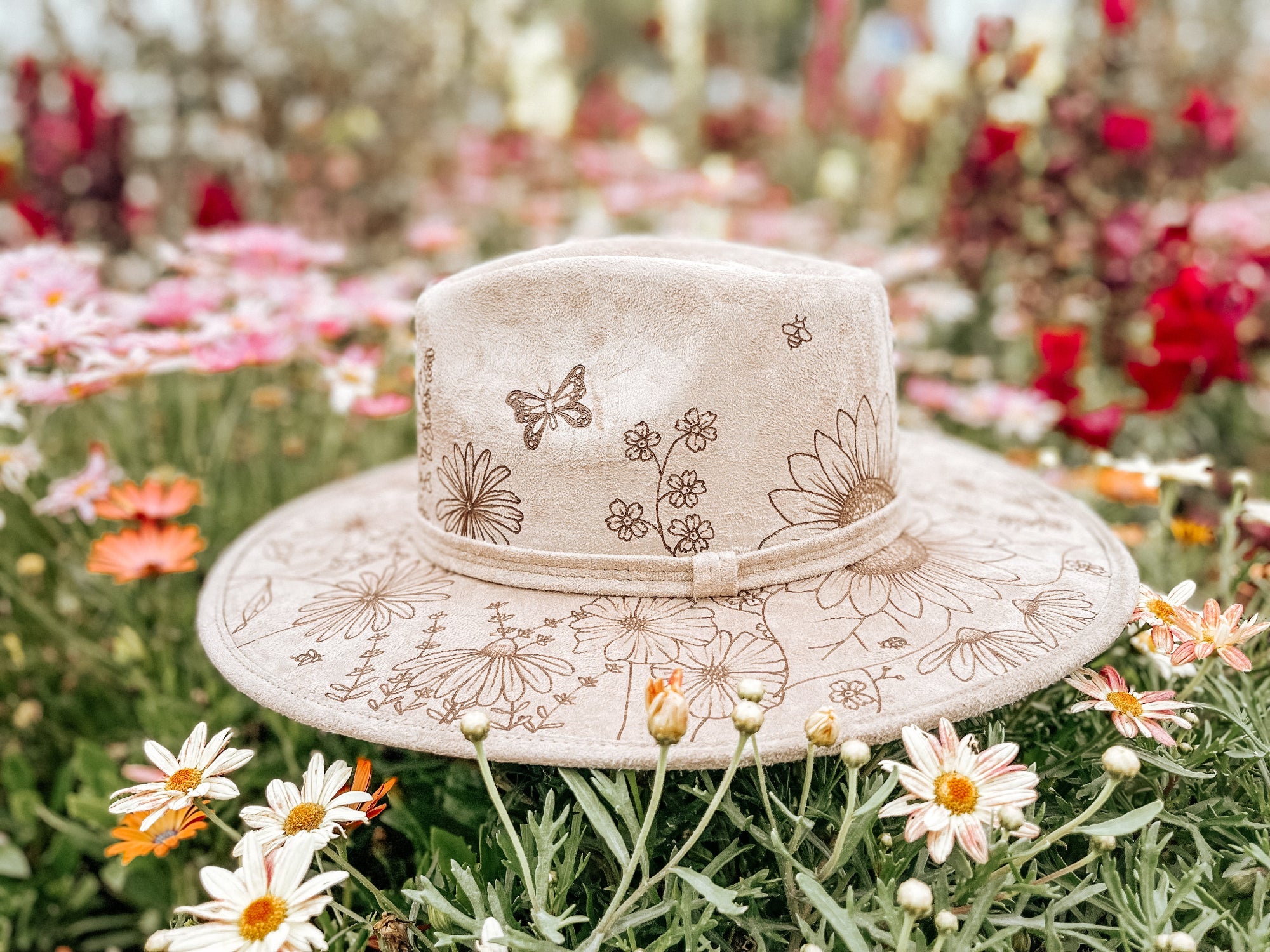 Light taupe women's fedora hat with whimsical botanicals, butterflies, and bees