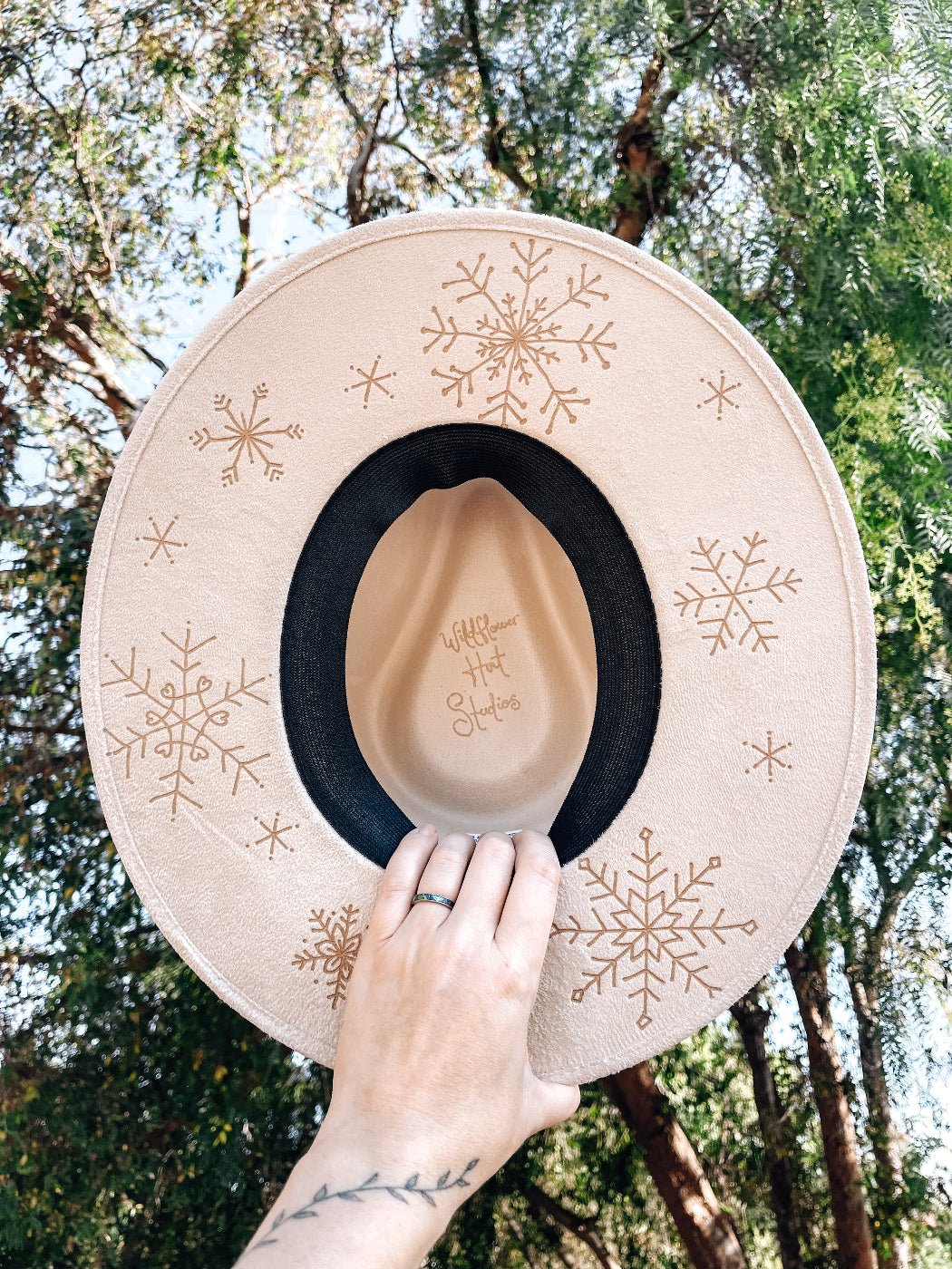Boho holiday hat with snowy design, shown in white