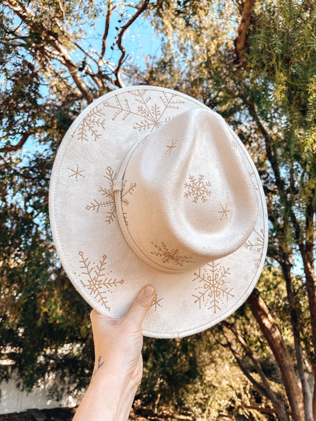 Boho holiday hat with snowy design, shown in white