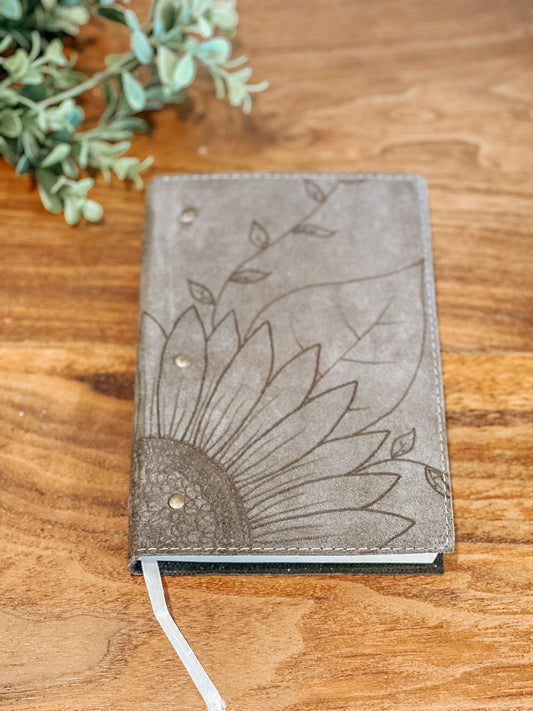 Gray faux suede journal with hand-burned sunflower design on the front cover
