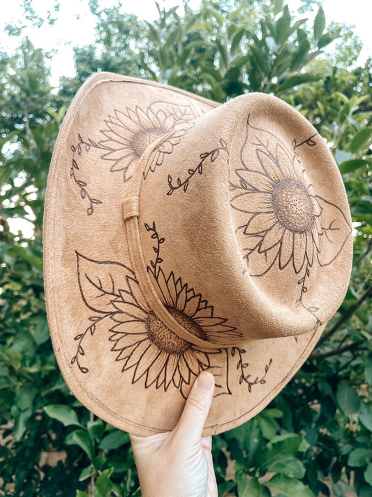 Western floral hat with bold sunflower artwork in boho style