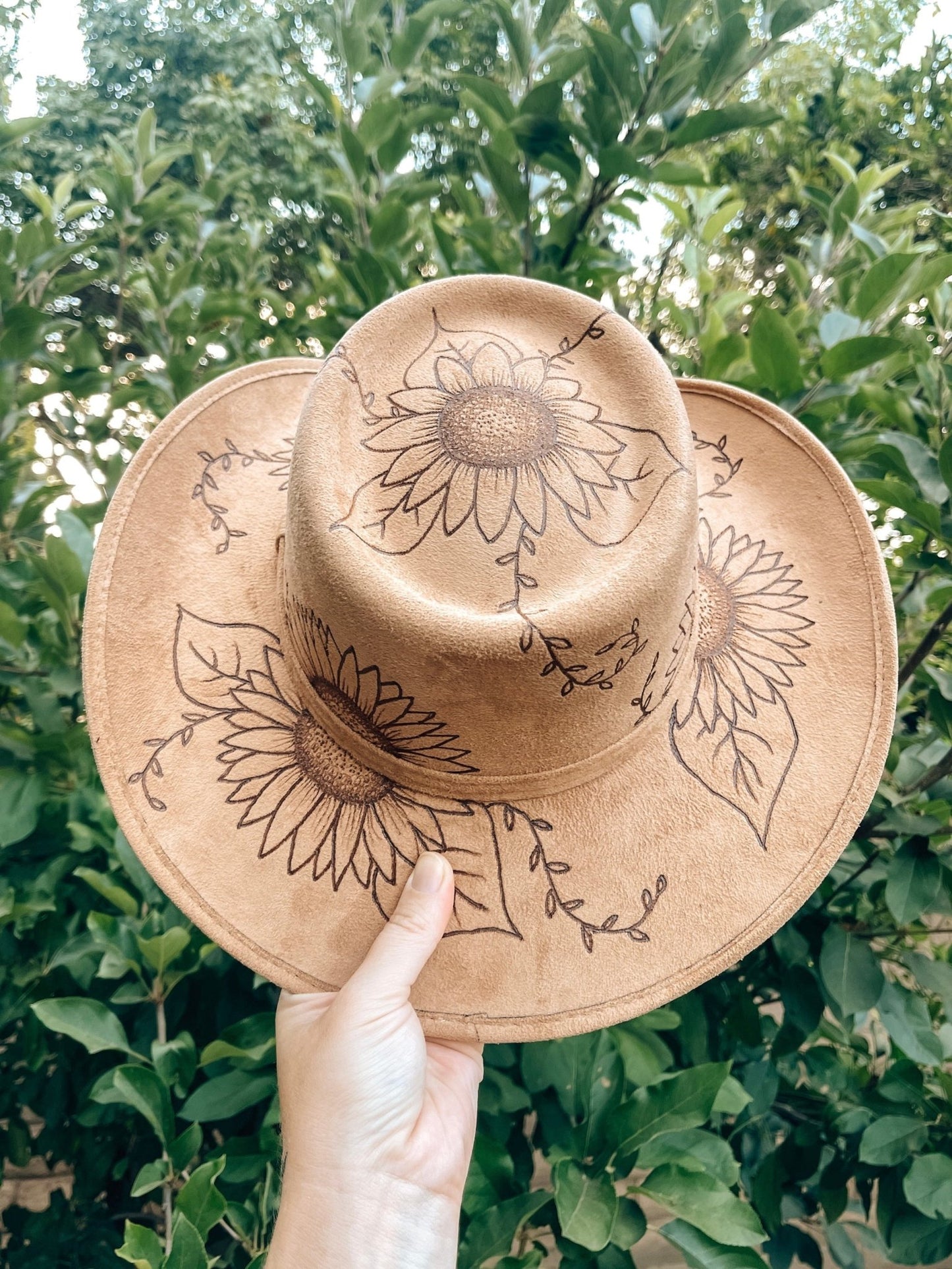Western floral hat with bold sunflower artwork in boho style