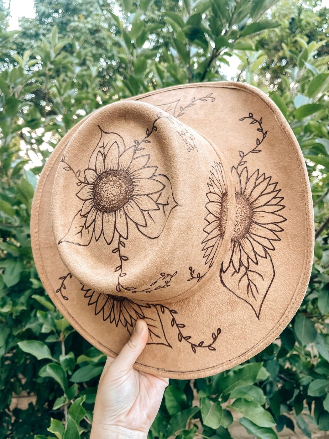 Western floral hat with bold sunflower artwork in boho style