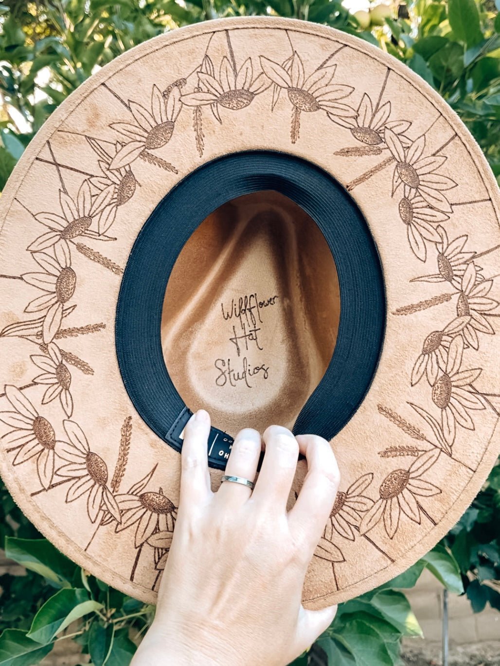 Maximalist fedora covered in hand-drawn wildflowers, inspired by California superbloom shown in light tan