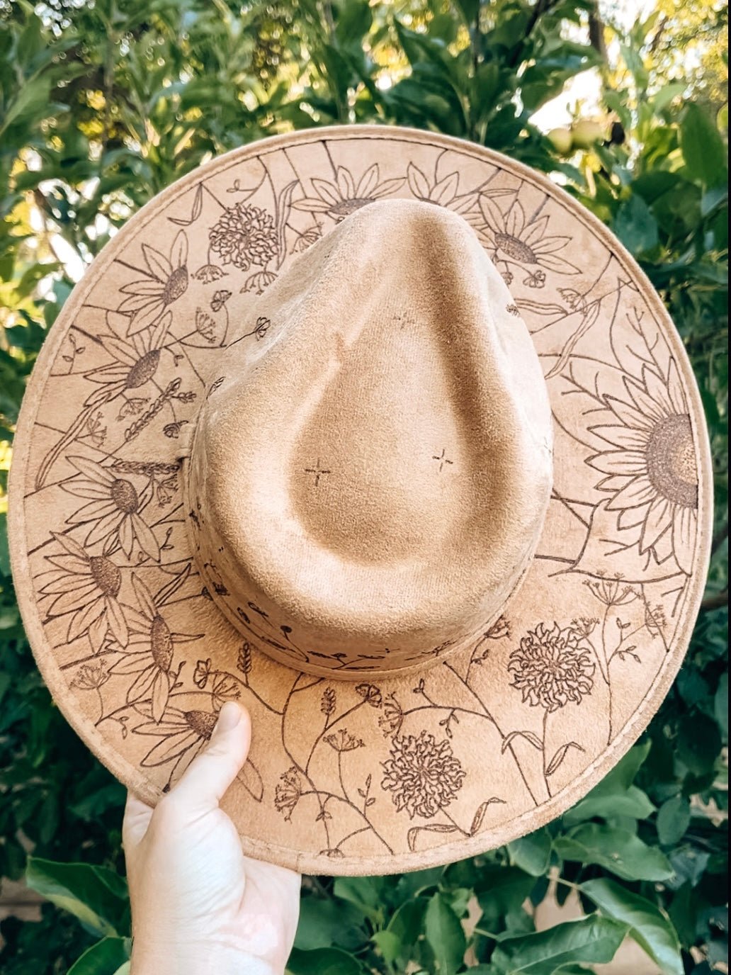 Maximalist fedora covered in hand-drawn wildflowers, inspired by California superbloom shown in light tan