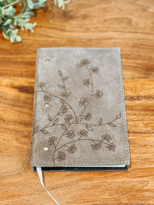 Gray faux suede journal with hand-burned wildflower illustration on the front cover