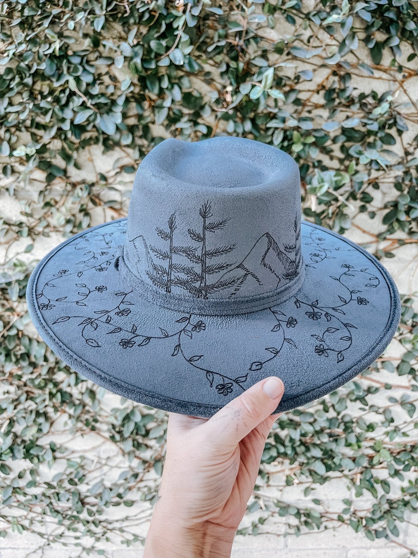 "Wanderer’s Peak" – Hand-Drawn Denim Blue Fedora with Mountain and Wildflower Design