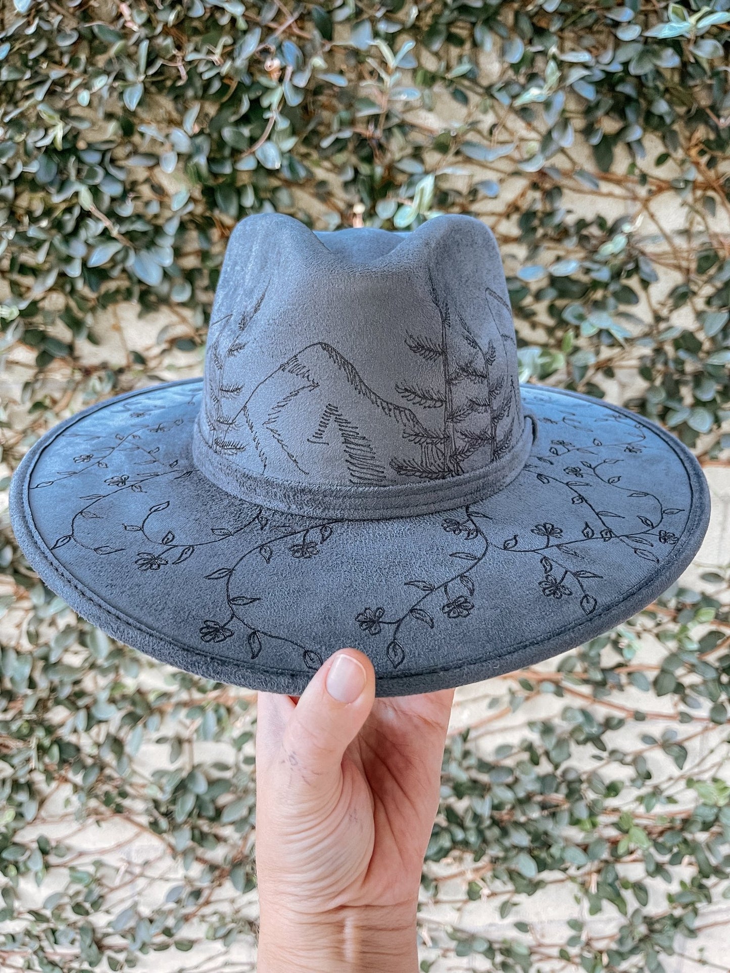 "Wanderer’s Peak" – Hand-Drawn Denim Blue Fedora with Mountain and Wildflower Design